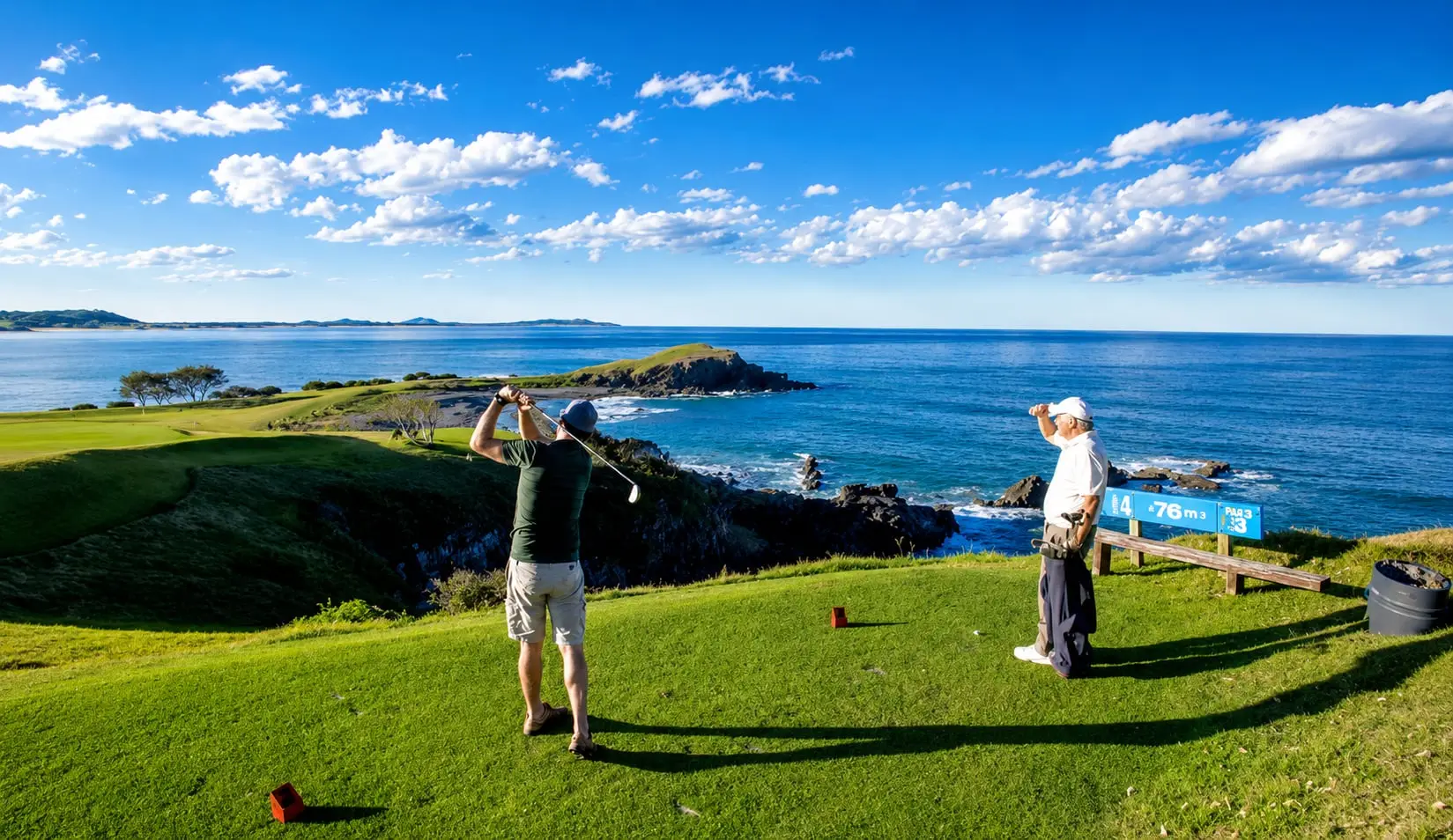 Golfer mid-swing on the Crescent Head Country Club headland