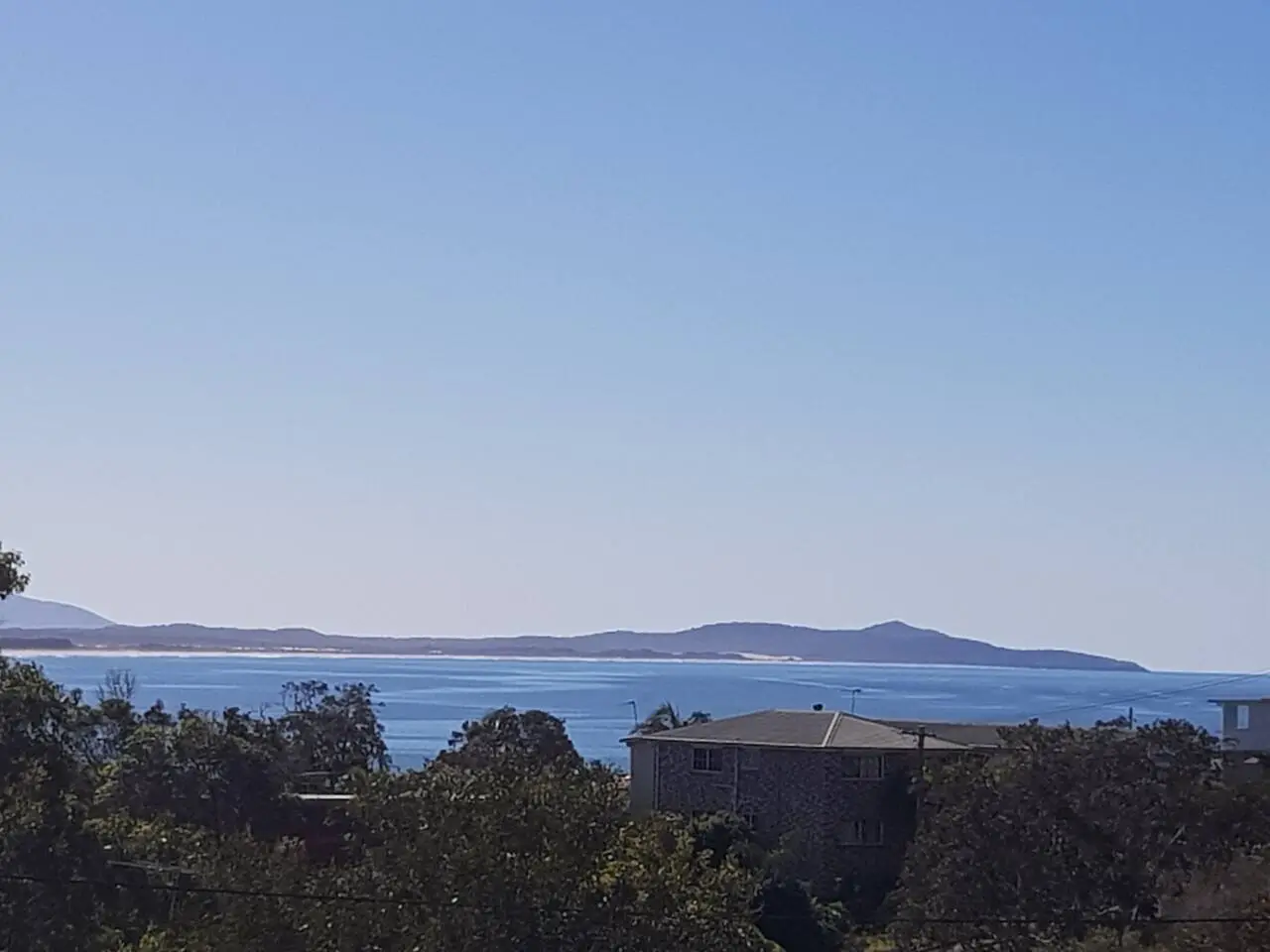 The view south from the Crescent Head headland over the bay toward Hat Head